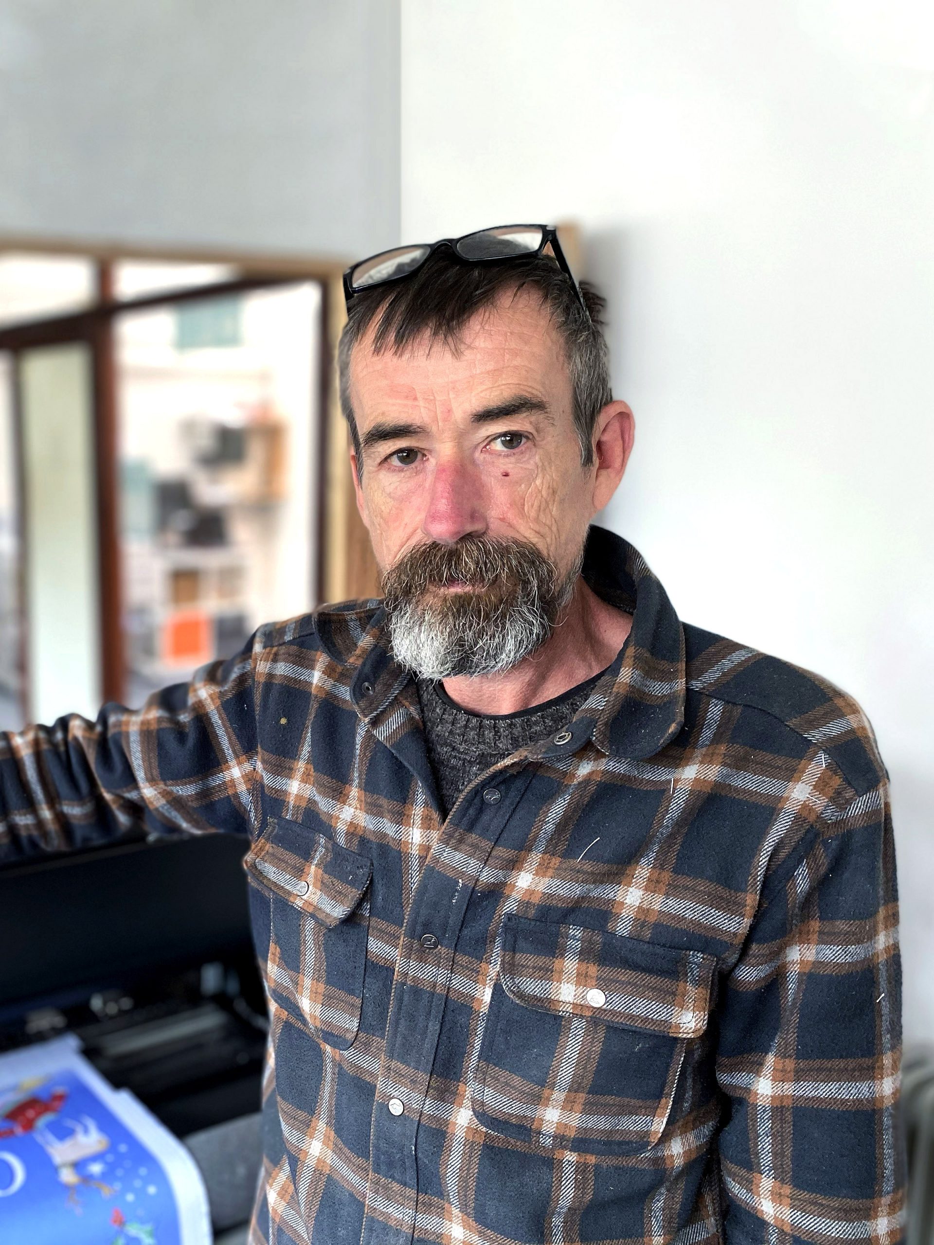 Wyn standing in our digtial textile print workshop in Wrexham, UK